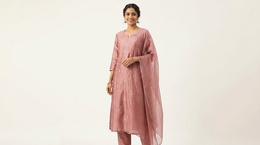 Editorial illustration of a woman wearing a pink kurta set