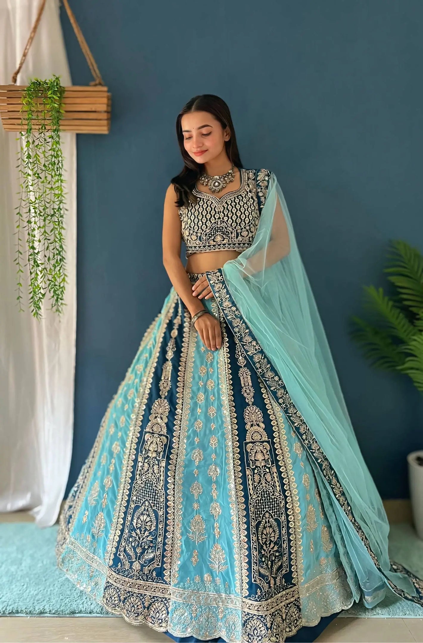 Aqua Blue Faux Georgette Embroidered Lehenga Set for Wedding and Festive Wear