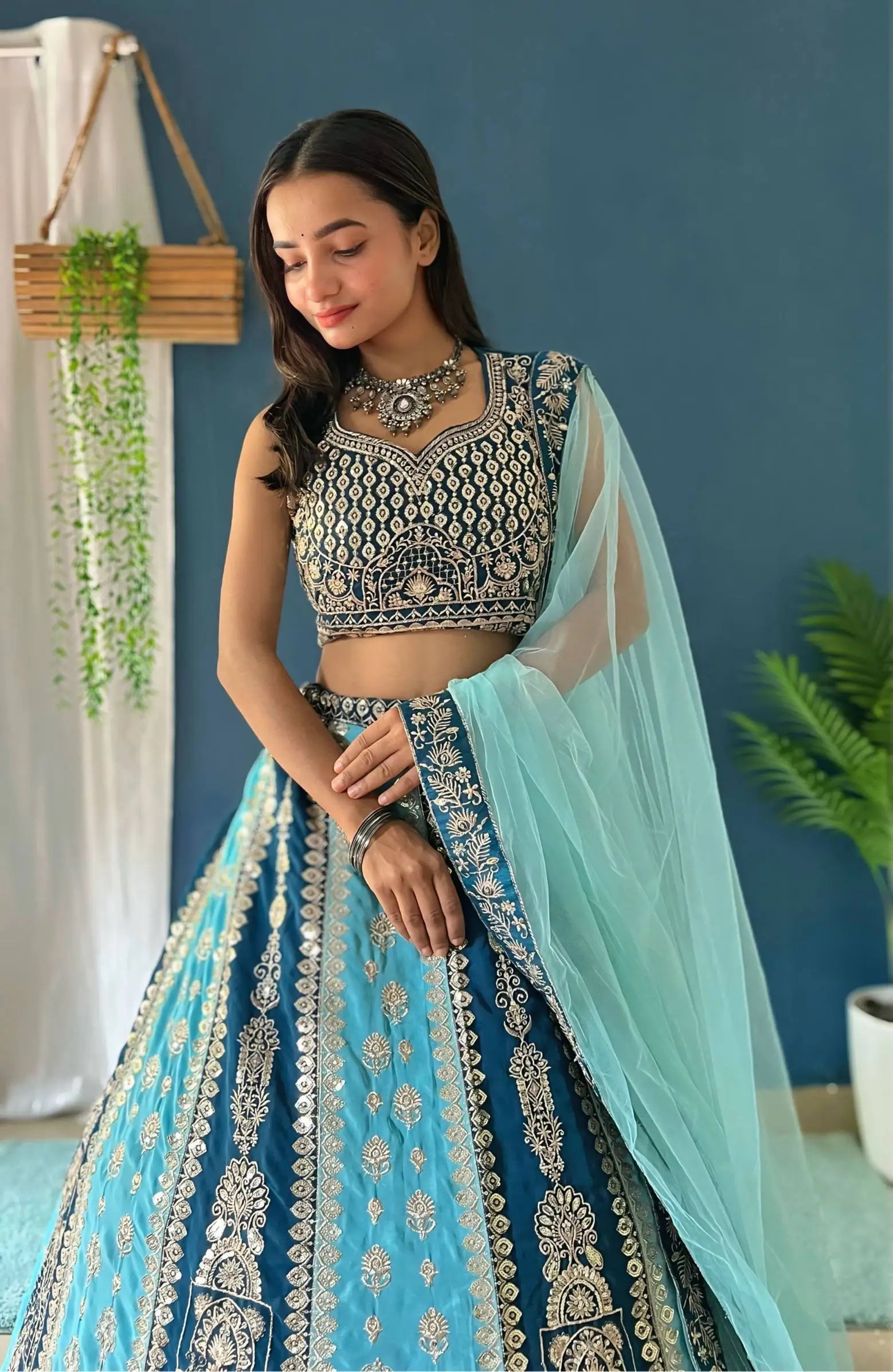 Aqua Blue Faux Georgette Embroidered Lehenga Set for Wedding and Festive Wear