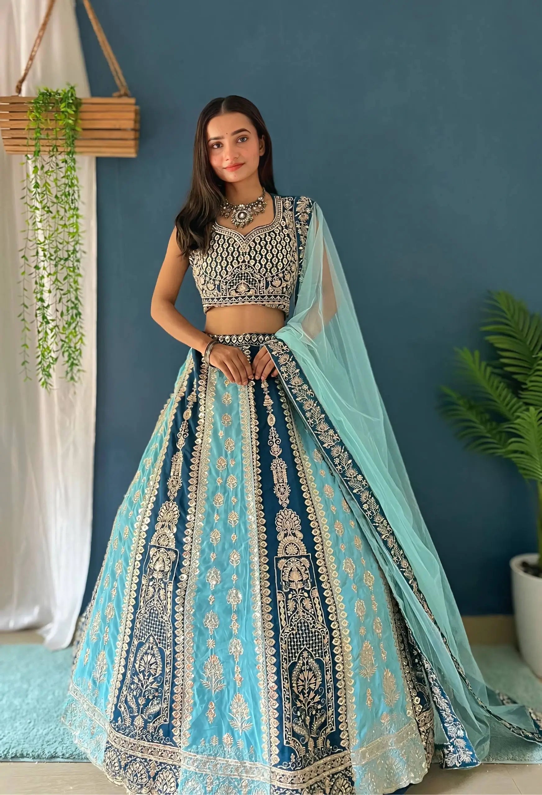Aqua Blue Faux Georgette Embroidered Lehenga Set for Wedding and Festive Wear